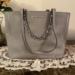 Michael Kors  Gray Tote Handbag. Six compartments, 2 have zippers. Like New